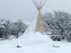 Massage teepee covered in snow